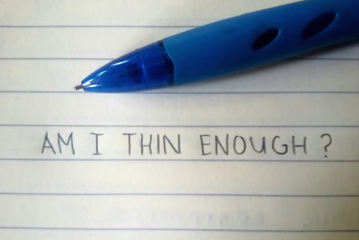 Paper with the words "Am I thin enough?" written on it